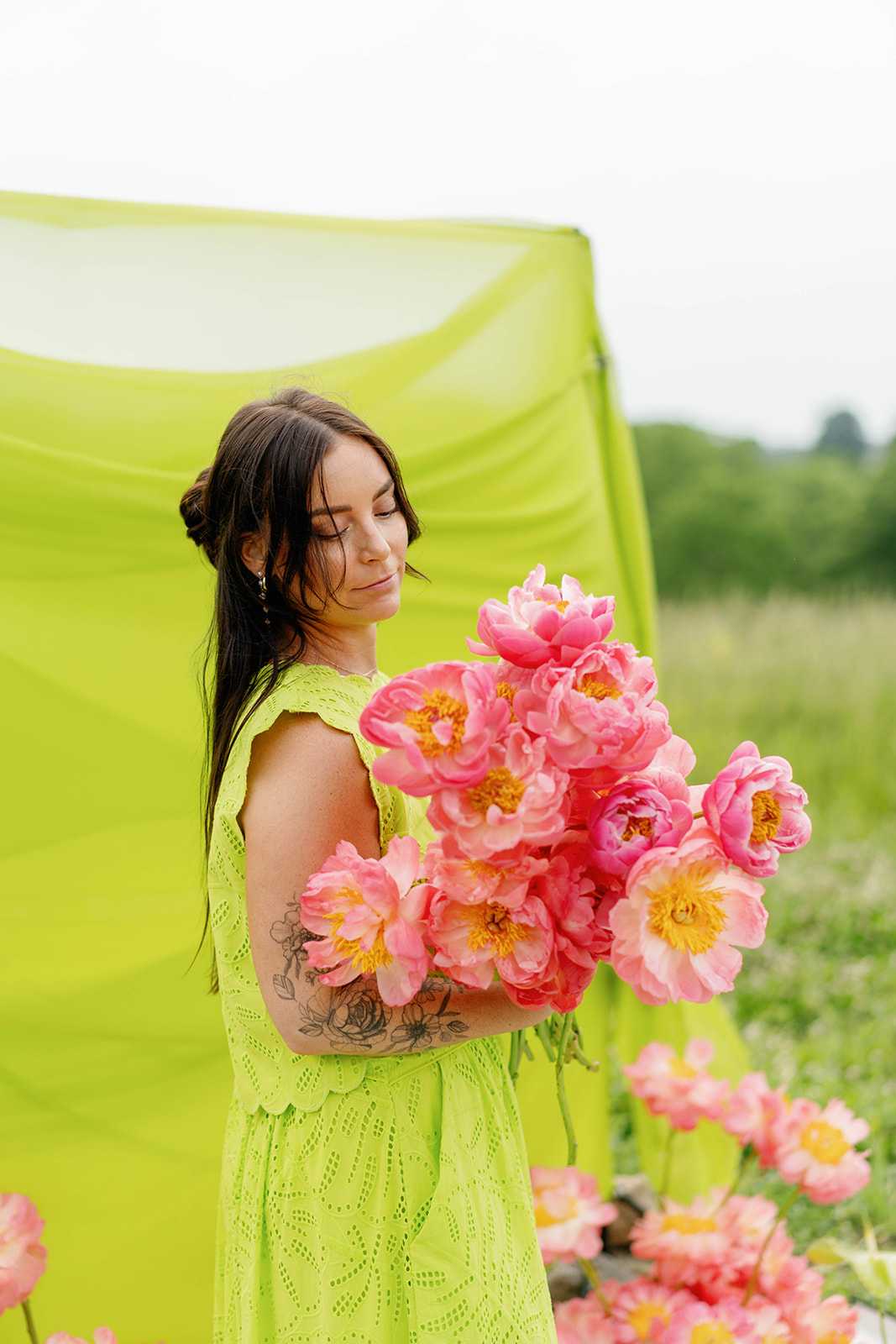 Sarina posing with a bouquet of flowers