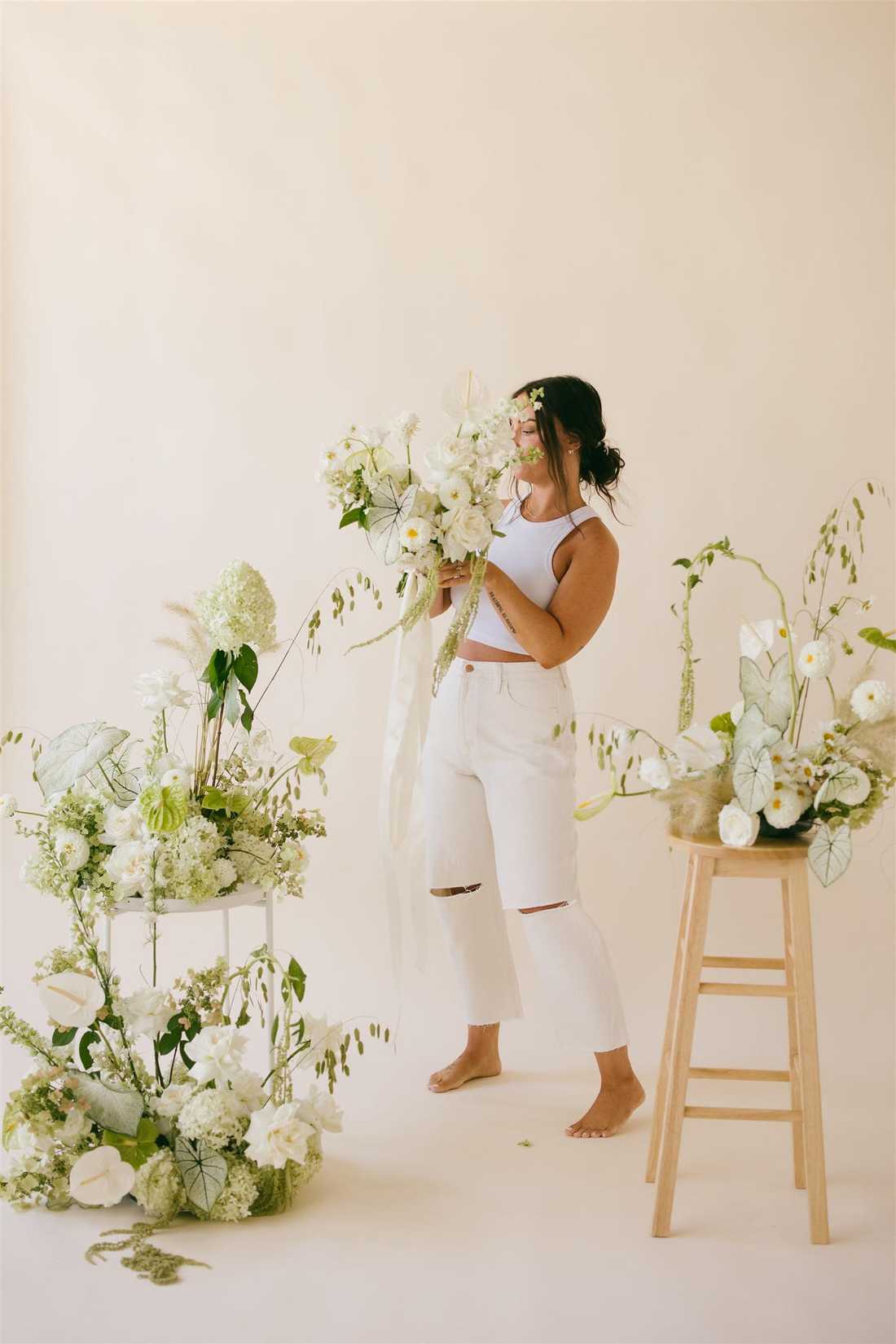 Sarina posing with a bouquet of flowers